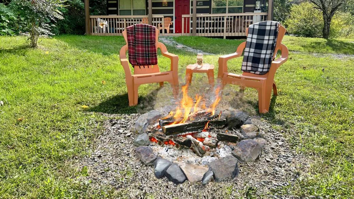 A cozy fire pit setup with Adirondack chairs draped in checkered blankets is set against the backdrop of the cabin, inviting guests to gather for stories, marshmallow roasting, or stargazing under the night sky.